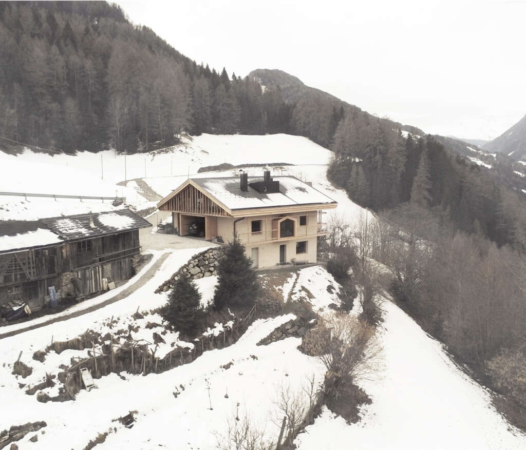 alpina architects convert old farmhouse into new alpine home in Racine, Italy