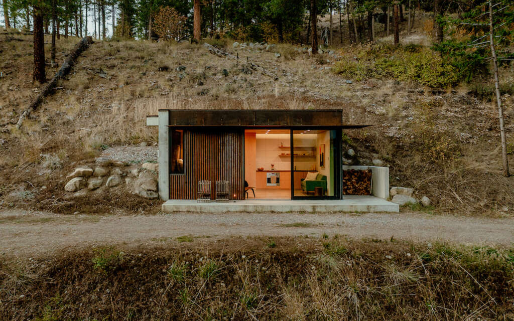 Escape to this tiny cabin in Washington State embedded into a valley hill