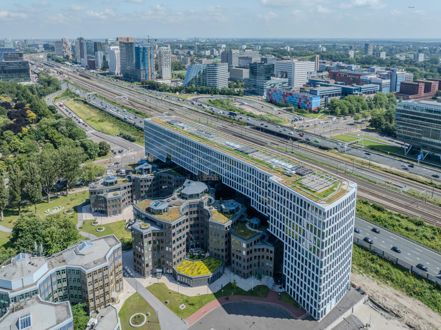 MVRDV completes Tripolis Park: Aldo van Eyck's final work renovated and protected by an office landscraper