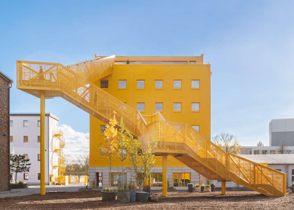 MVRDV and Hirschmüller Schindele Architekten complete bright yellow renovation and addition to outdated office building in Berlin