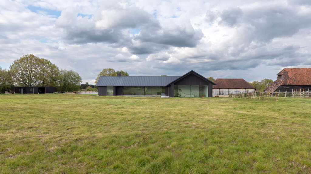 Weald House is a rural retreat sensitively embedded into the Kentish landscape
