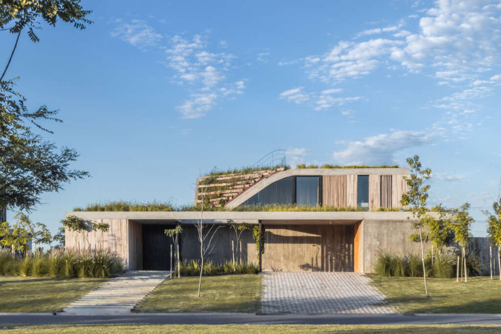 “A house that rises from the ground forming a three-level garden, merging nature and architecture”
