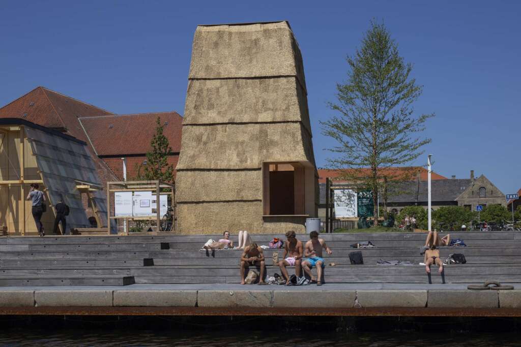 RØNNOW LETH & GORI and CINARK design temporary thatched brick pavilion in Copenhagen