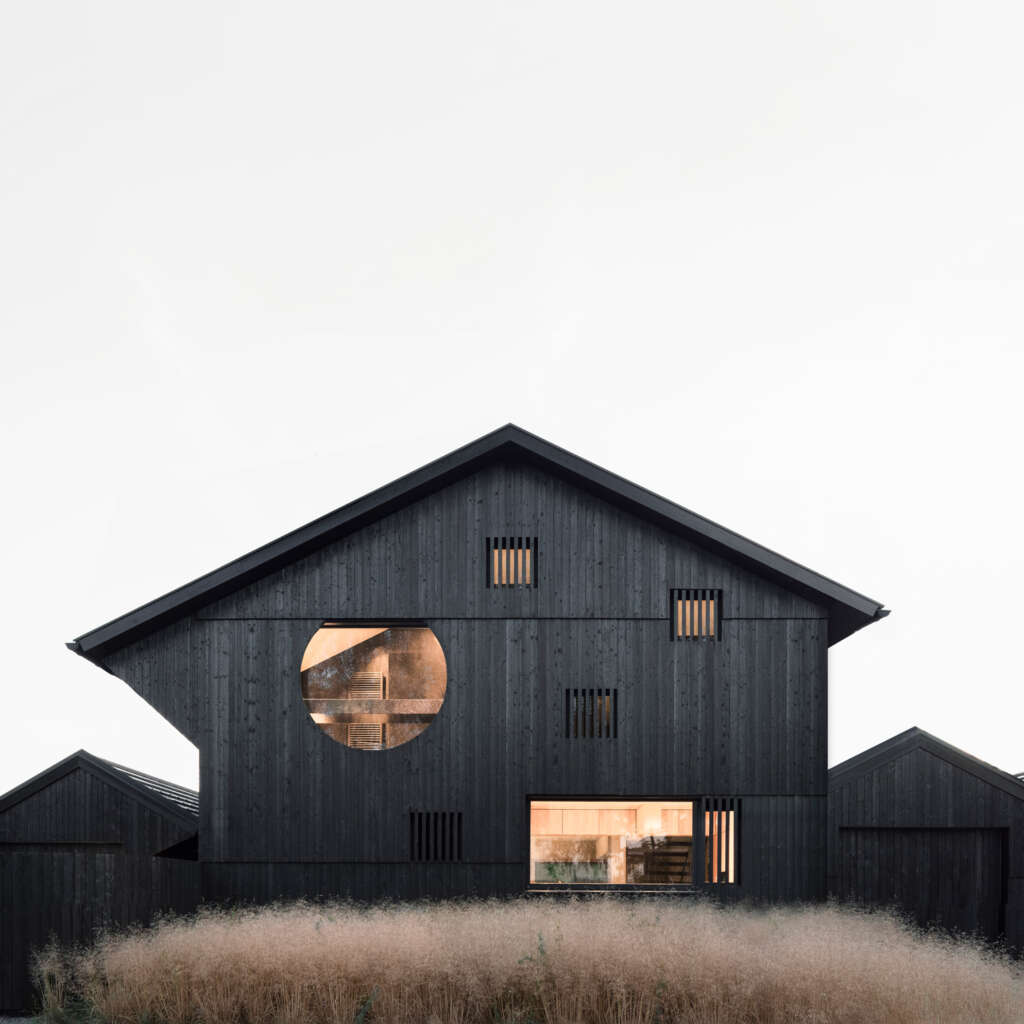 Buero Wagner design two homes with charred façades in the foothills of the Alps