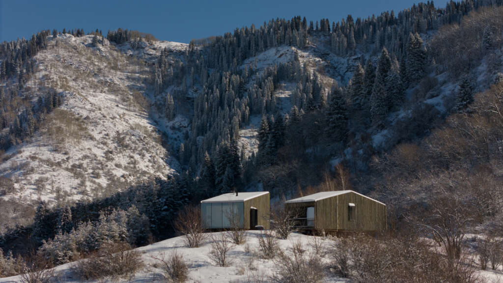Escape to these cabins set within a mountainous landscape in Kazakhstan