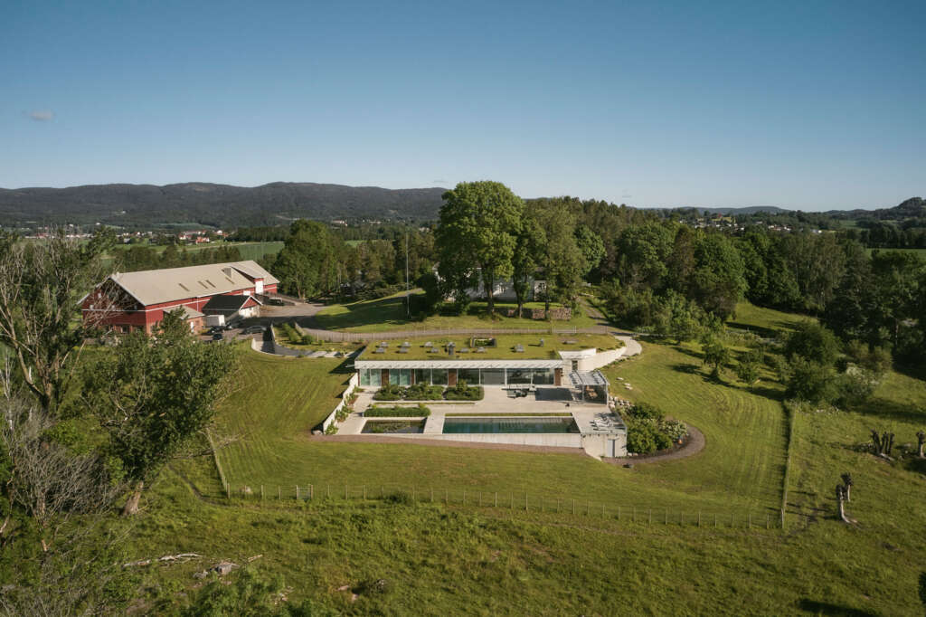 C.F. Møller Architects design 'invisible' villa integrated into surrounding farmland