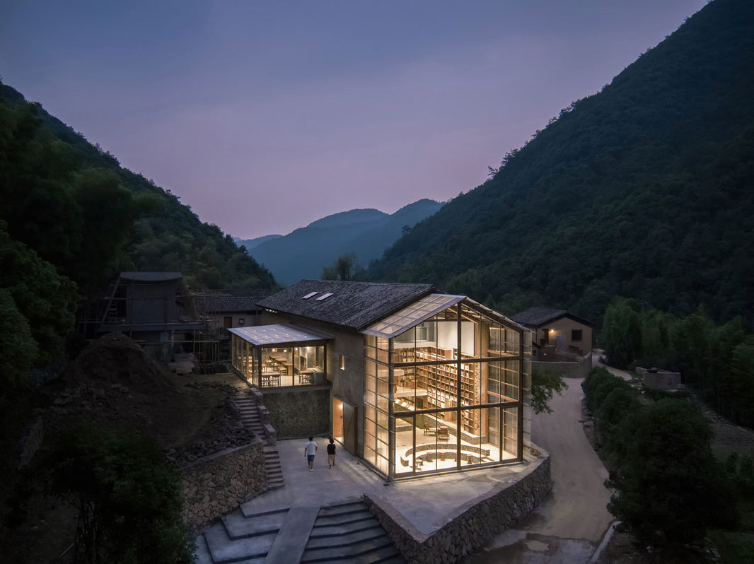 Atelier tao+c repurpose an old wood house into a hotel, library and bookstore