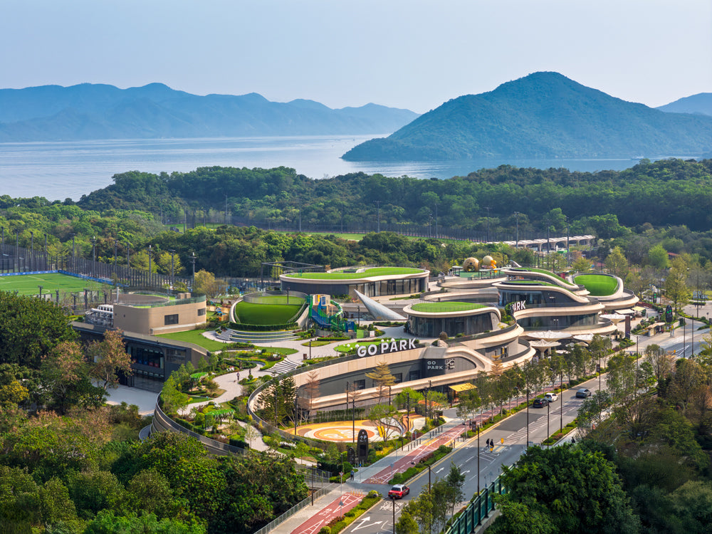 Zaha Hadid Architects complete sports and commercial complex nestled between mountains and cove in Hong Kong