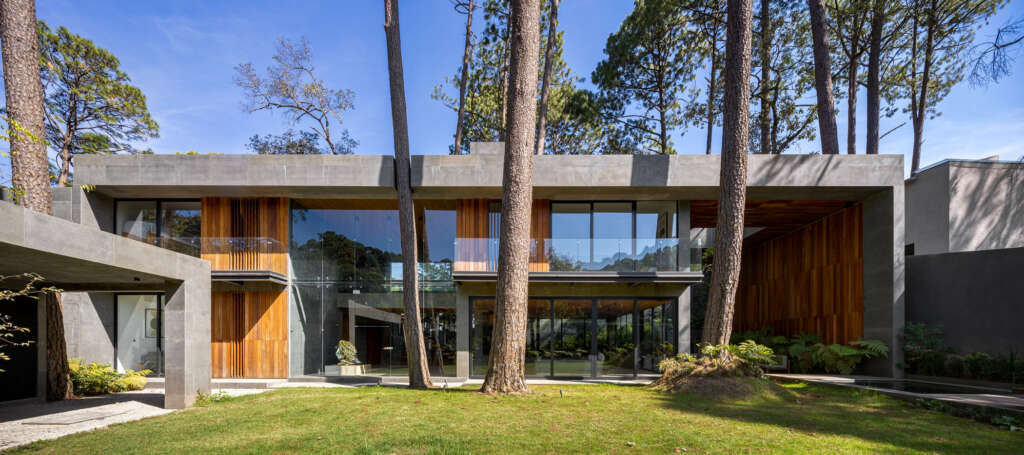 BRAG Arquitectos design stone-framed house for contemplating the forest