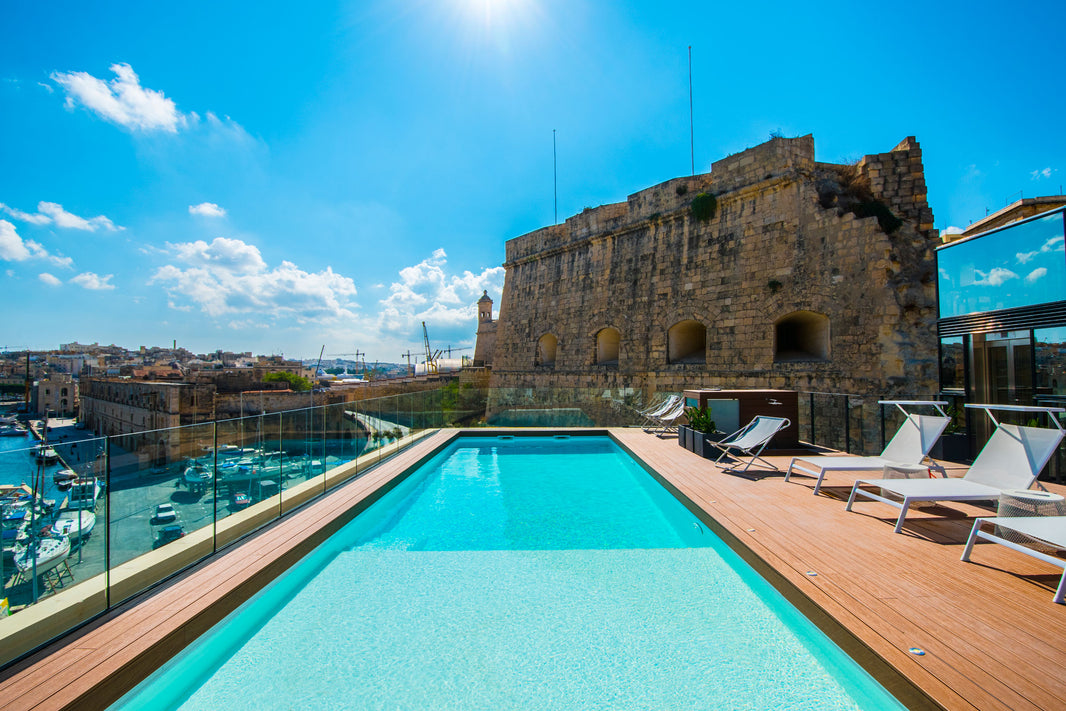 This Beautifully Restored Hotel in Malta is Nestled Against a Fortress in the City's Ancient Harbour.