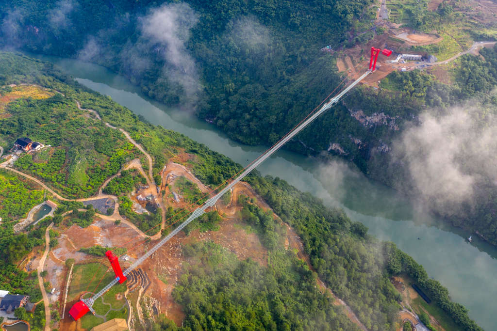 Majestic glass bridge opens in the Huangchuan three gorges scenic area