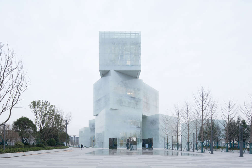 Zone of Utopia and Mathieu Forest Architecte design tourism center that appears like stacked Ice Cubes