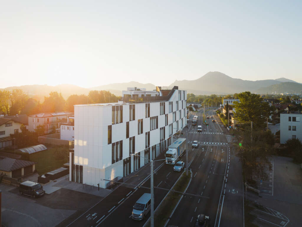 Lechner & Lechner architects design new mixed-use building extending over a motorway on the outskirts of Salzburg