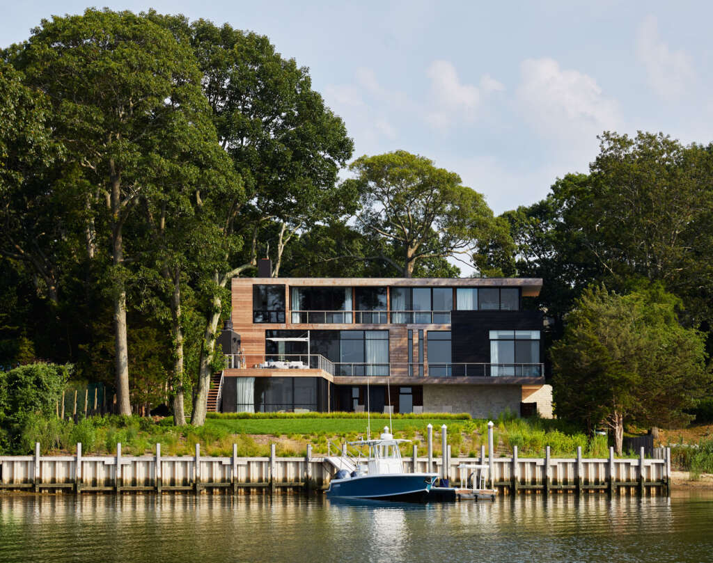 This waterfront home in Long Island is nestled into a protected cove