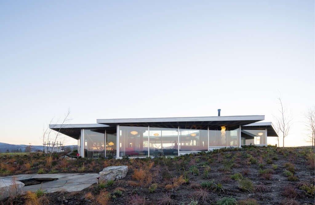 NO ARCHITECTURE design glass house organized as interlocking pavilions around a central courtyard