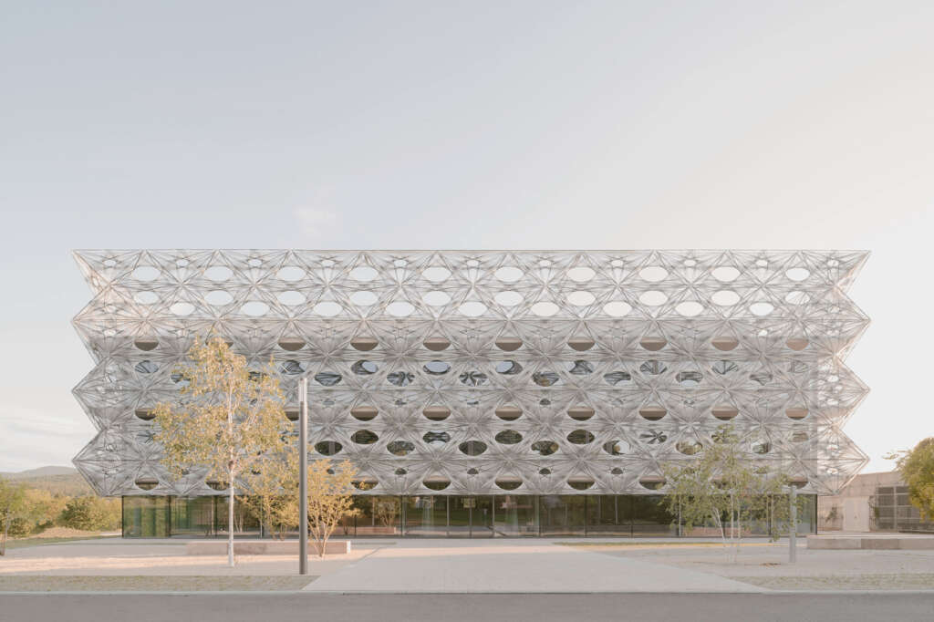 allmannwappner design research and innovation building with a woven carbon and glass fiber tile façade