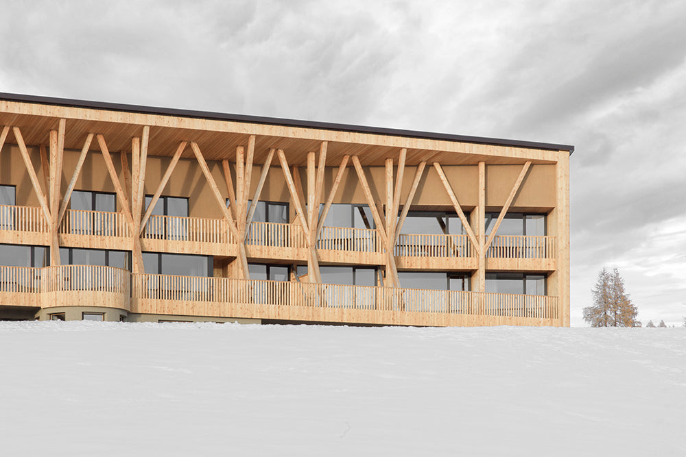 MoDus Architects complete stunning wood hotel transformation set against the Dolomite mountains