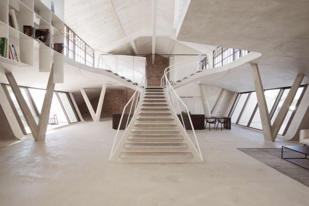 smartvoll reinterprets the traditional loft with this waxed concrete stair in Salburg