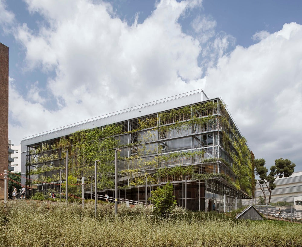 This sports center in Barcelona is wrapped in a giant green mesh