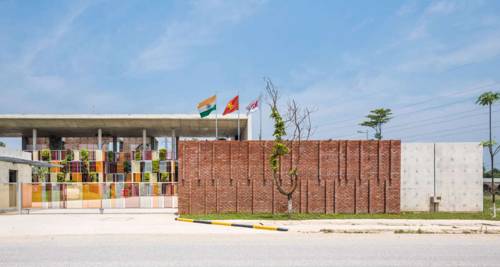 Office building in Hanoi uses colourful screens to enclose courtyards