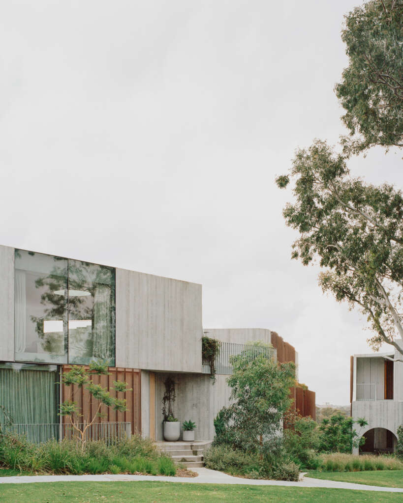 Perched on the edge of an escarpment, these Kew villas create a meaningful connection to its natural site