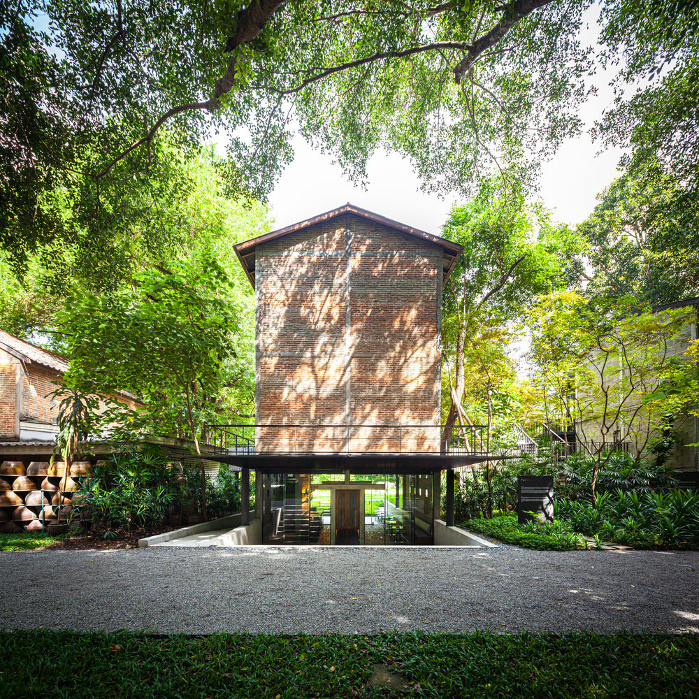 PAVA architects adapt former tobacco processing plant into museum and tea barn in Chiang Mai