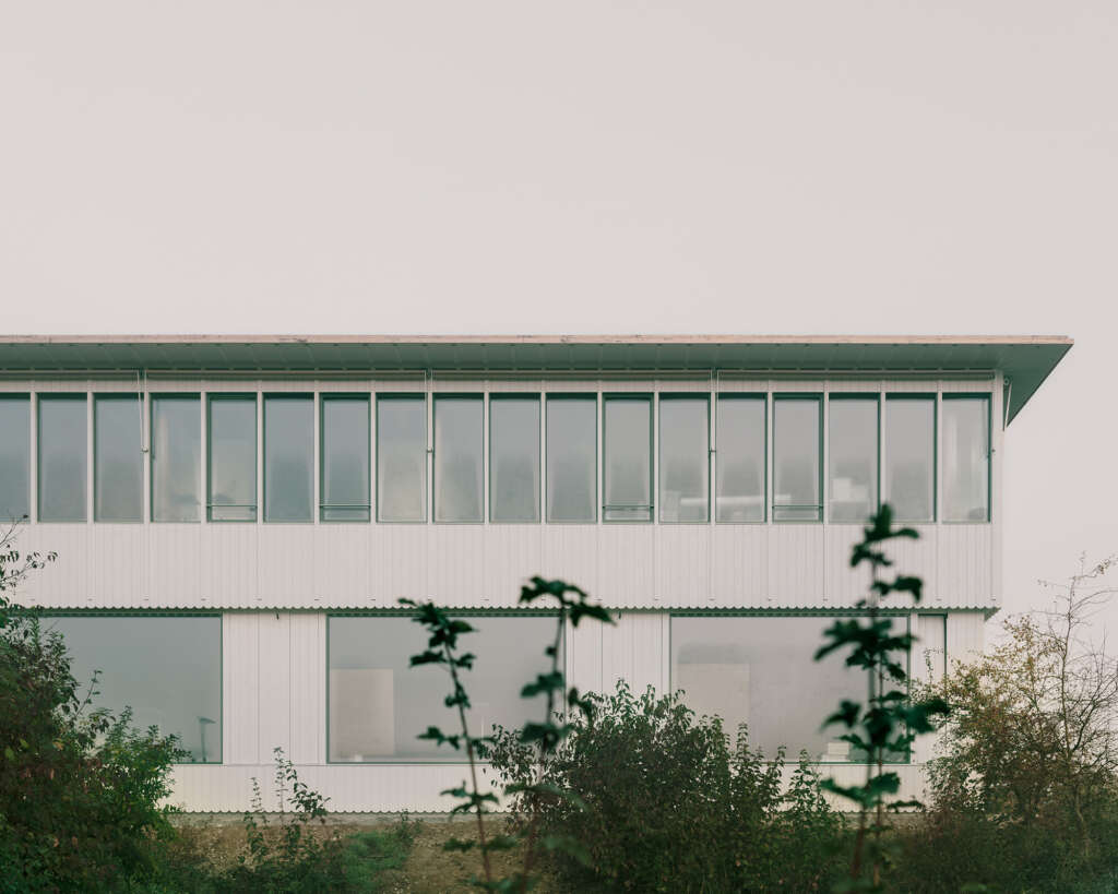Haller Gut Architects complete school addition in Switzerland with hybrid concrete and timber structure