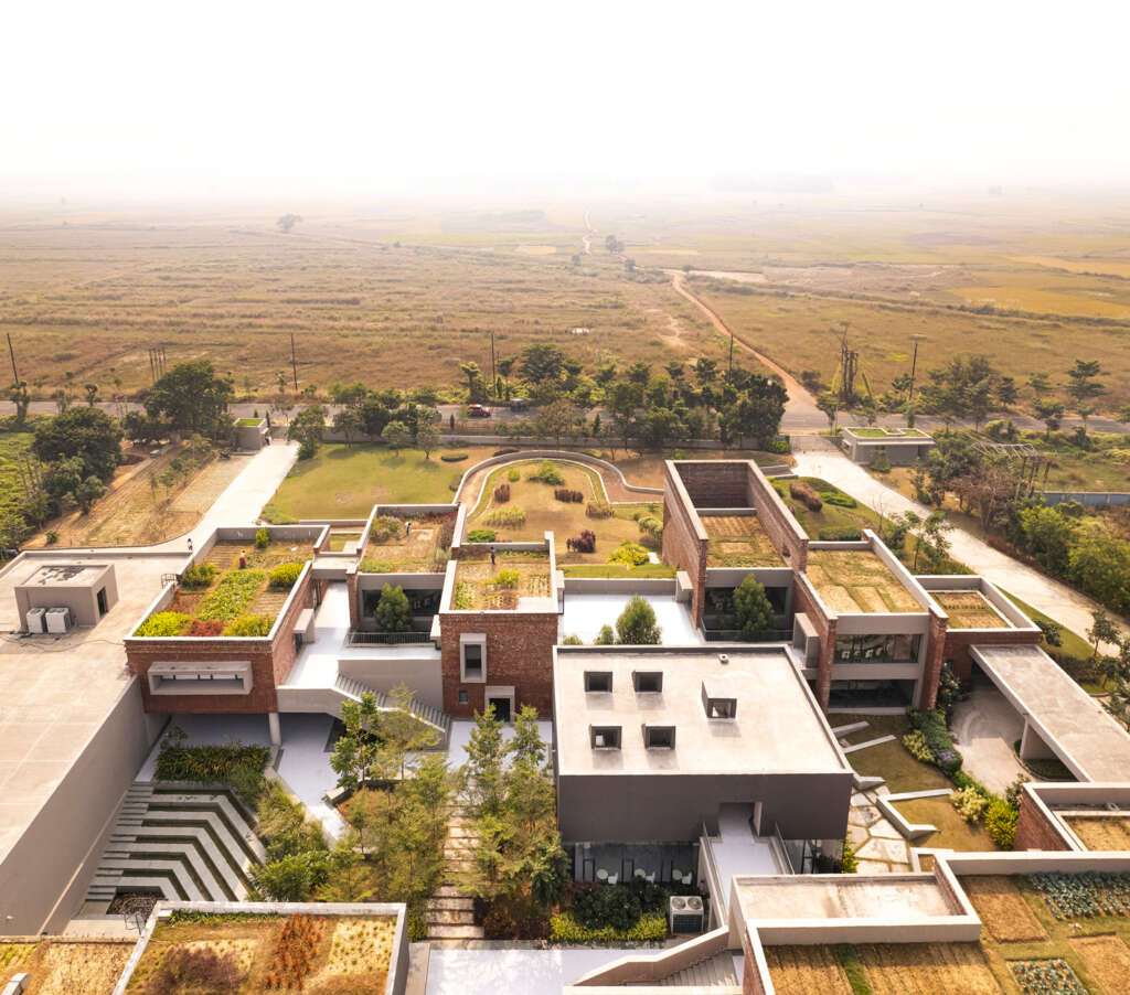 Abin Design Studio creates local business school in India that weaves the site into the architecture