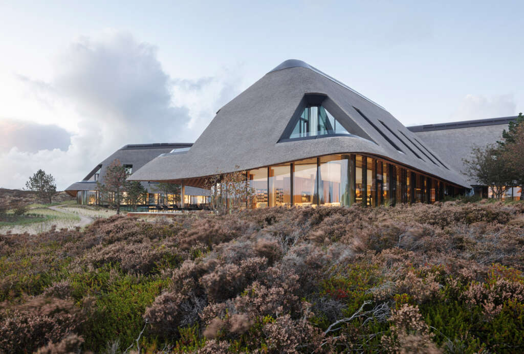 ingenhoven associates design thatched medical resort in a dune landscape in northern Germany