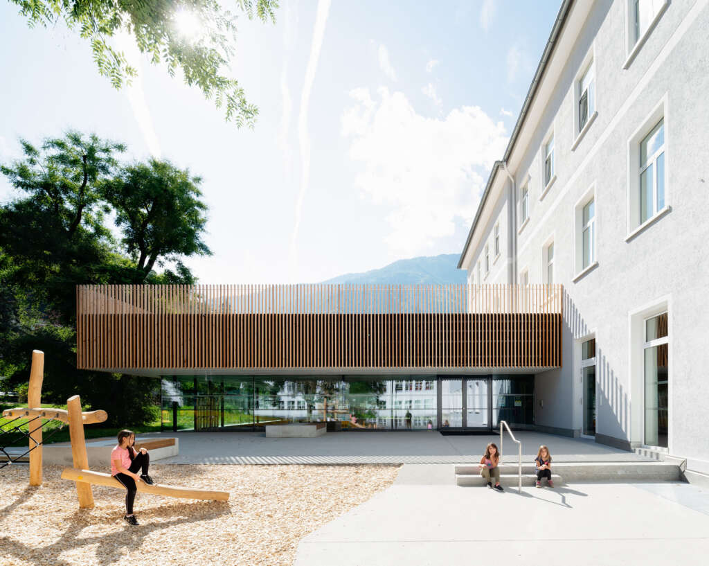 Franz&Sue design school extension with sunken gymnasium and rooftop terrace