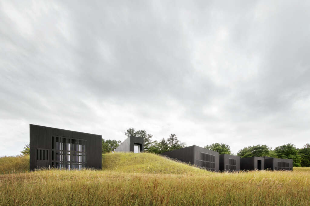 Ghent House is a collection of structures embedded into a hillside in New York State