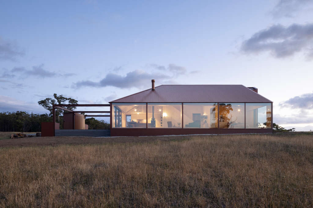 This contemporary farmhouse is nestled into the rural surrounds of Tasmania