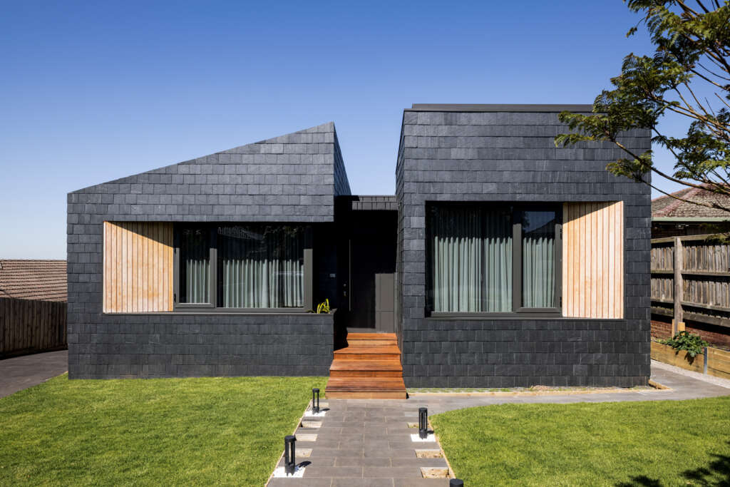 R Architecture designs house of courtyards with spanish slate shingles