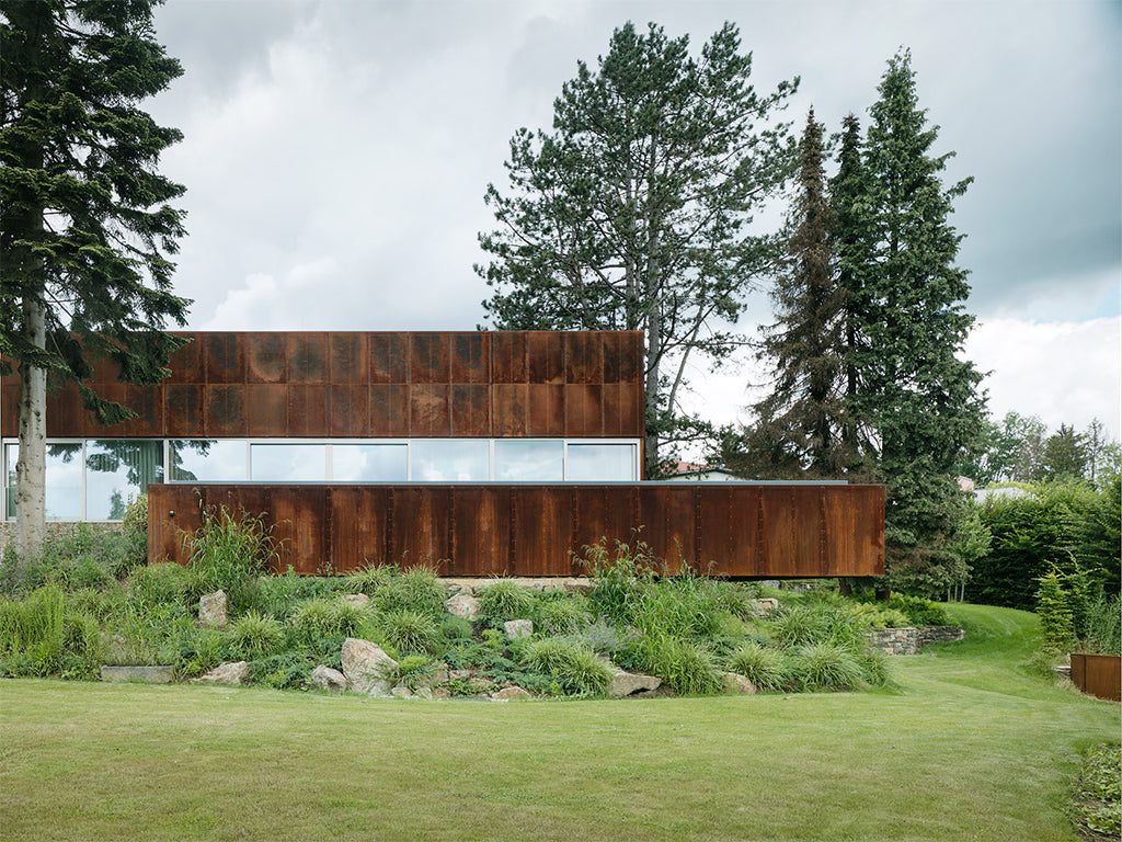 INNOCAD design deconstructed corten house overlooking Linz, Austria