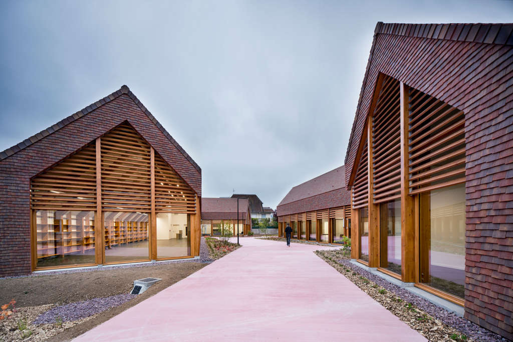 Community Centre in France is inspired by typical Normandy farmhouse