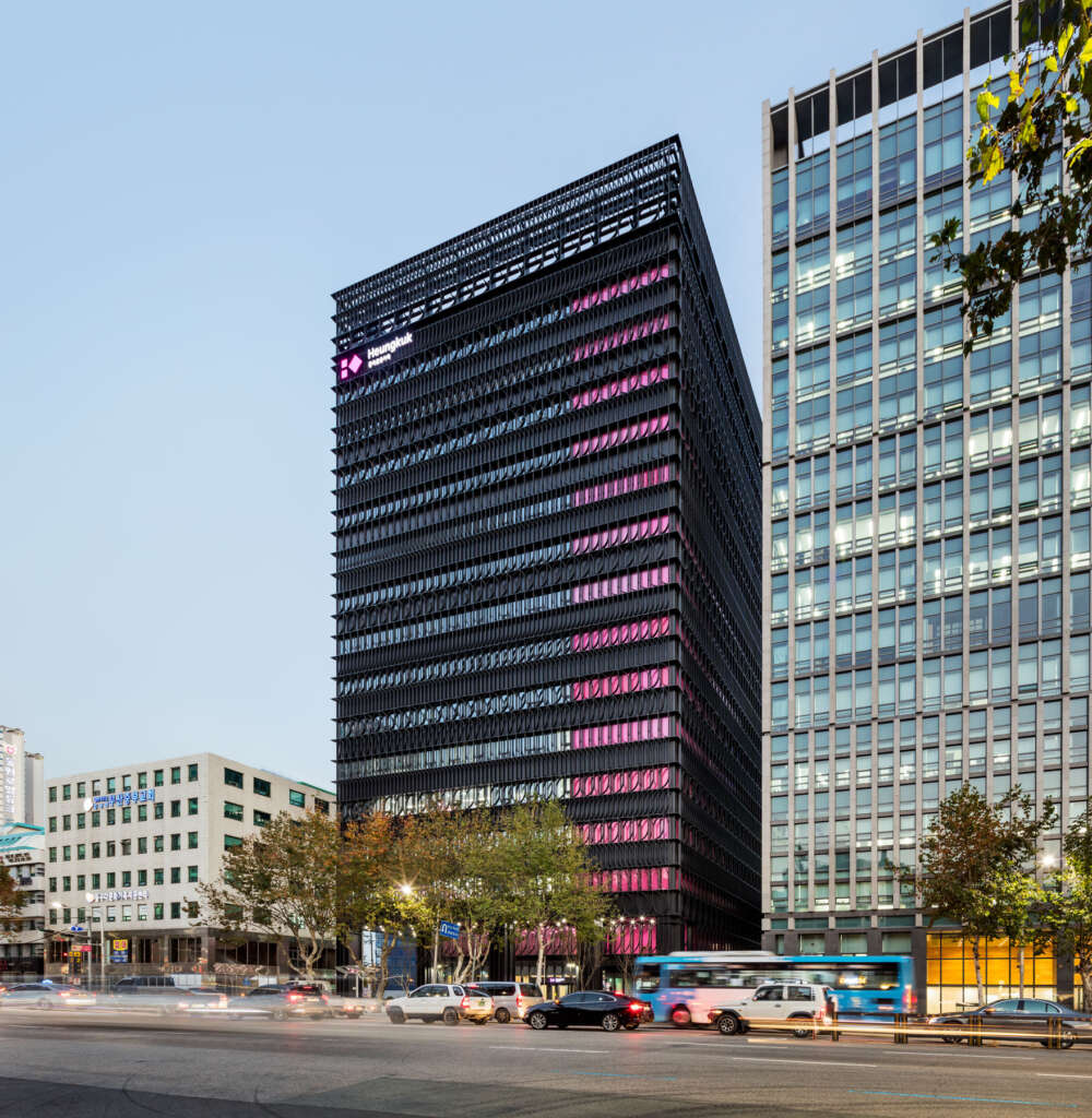 Mecanoo complete atmospheric black and fuchsia facade in Busan