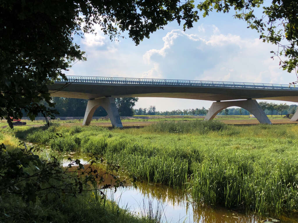 NEXT architects design a bridge over vulnerable agricultural land, forests, and a nature reserve
