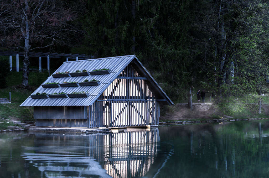 OFIS Architects completes restoration of wooden boathouse on Lake Bled, Slovenia