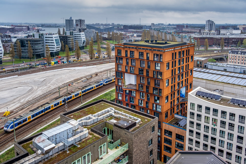 NEXT architects complete corten residential complex in Amsterdam with youth studios, senior housing and work spaces