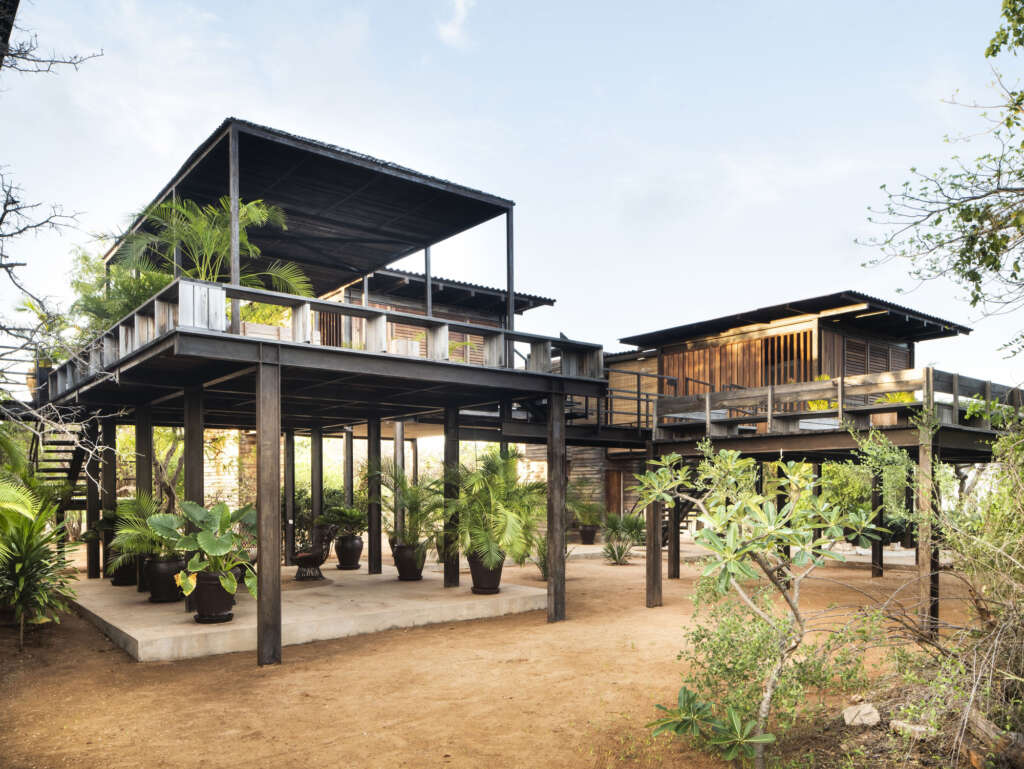 Designed by PAT. architetti associati, Falcon House rises amongst the Acacia and Baobab trees on Manda Island, Kenya