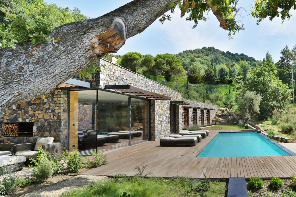 This Italian villa is built into the landscape with natural stone