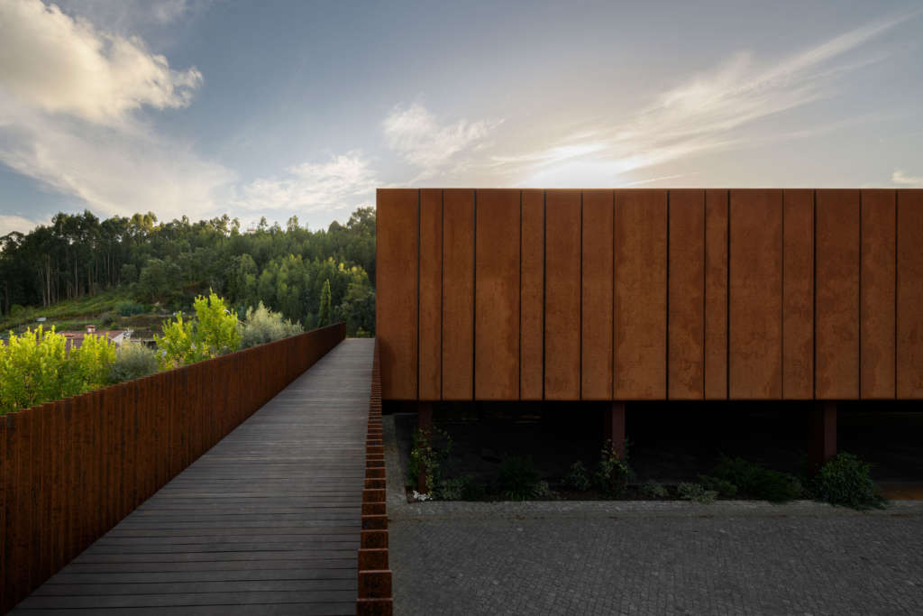 Corten box floats over rural Portuguese landscape