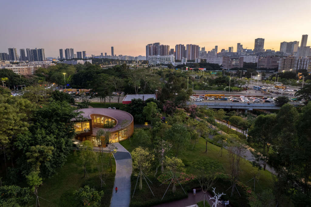 ATELIER XI design serpentine bookhouse overlooking the Dasha River Ecological Corridor in Shenzhen