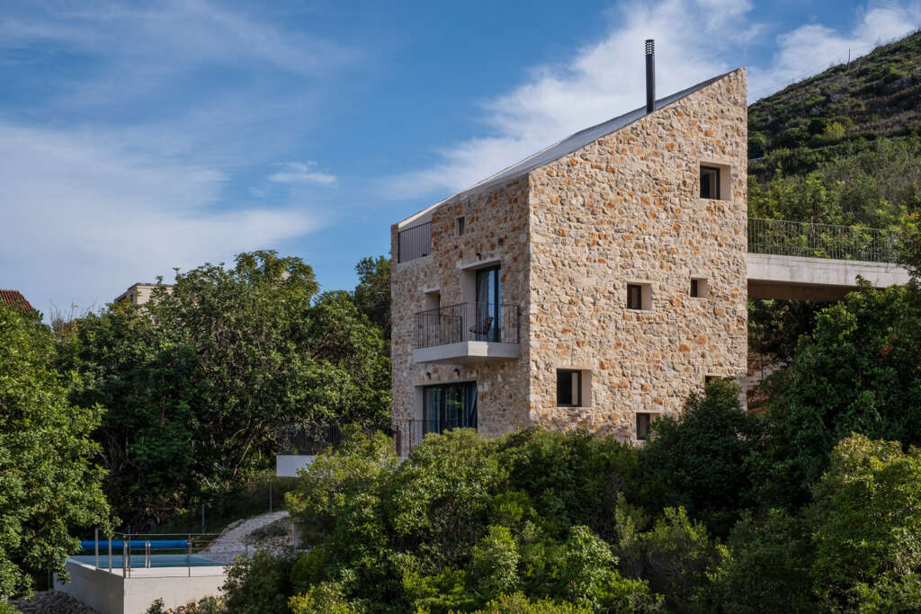 Situated on a steep plot, the Rogač House overlooks the Vis harbor in Croatia