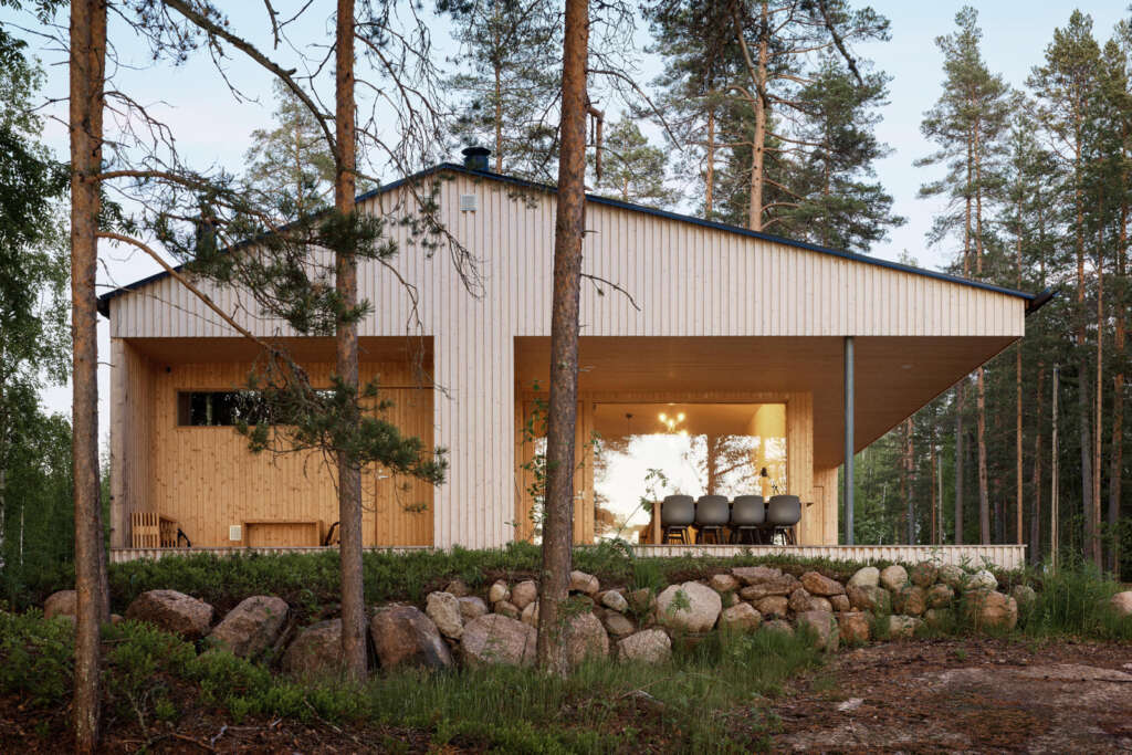 Playa Architects design lakeside house in Finland with covered outdoor areas