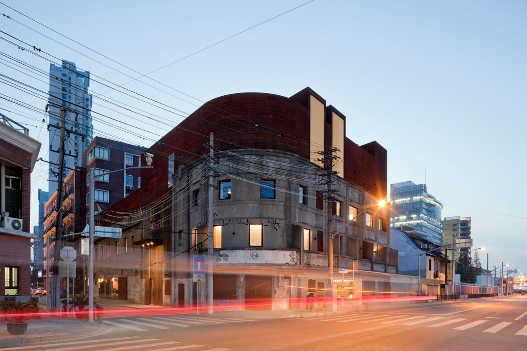 Neri&Hu design corten addition to old warehouse in Shanghai