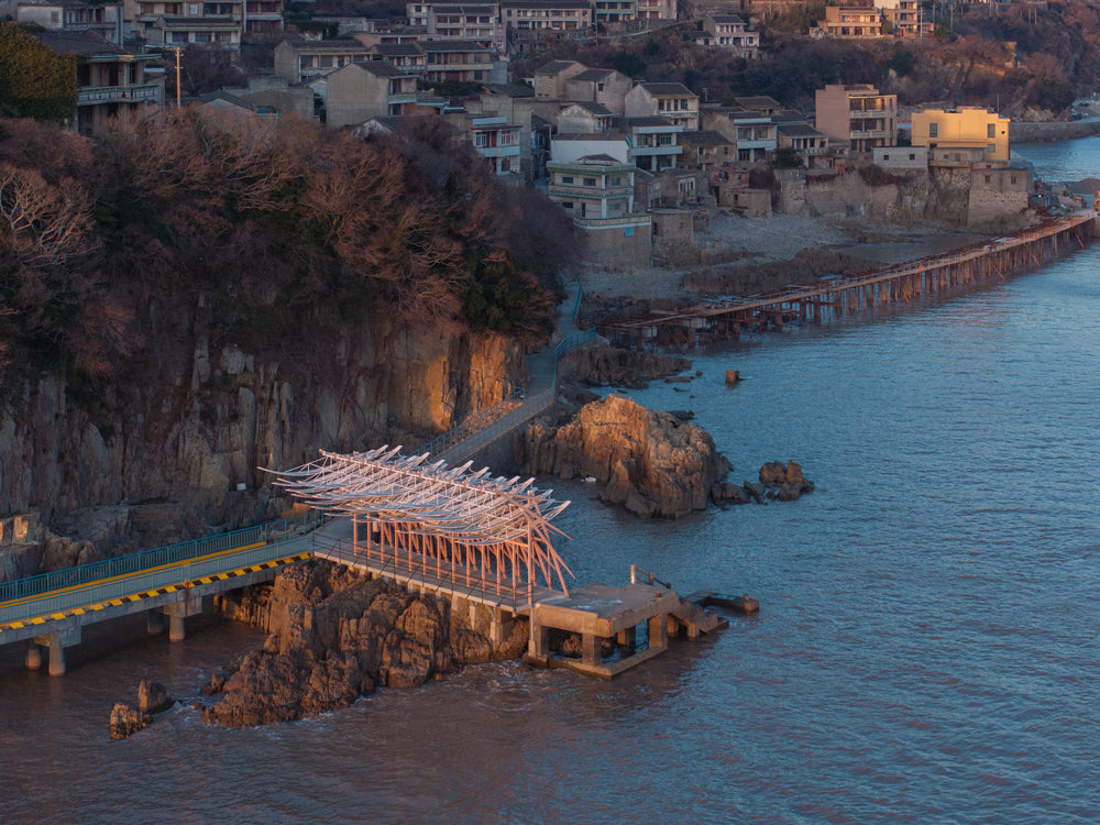 GN Architects design Seaside pavilion inspired by an "entrance tree" to traditional Chinese villages