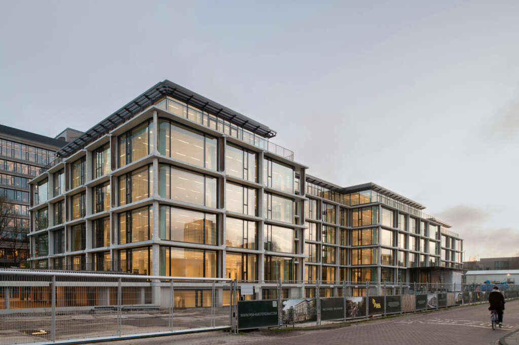 V8 Architects design elegant brutalist building in Amsterdam's Zuidas district
