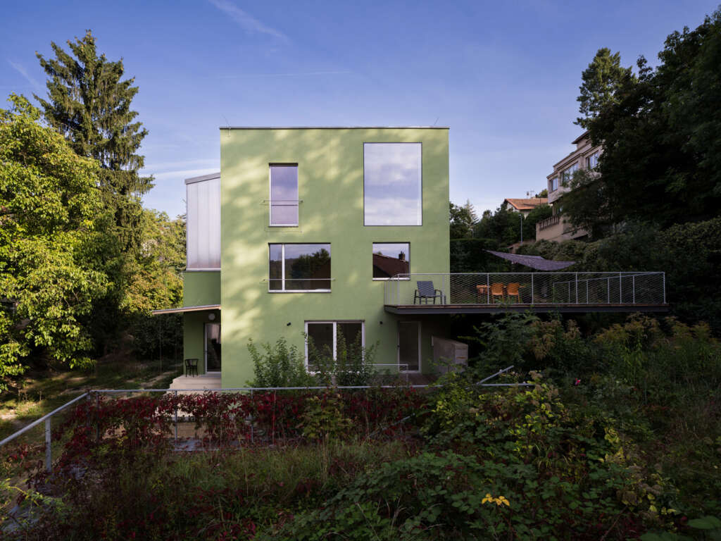 Studio Aoc architekti design green house connected to surrounding landscape in Prague
