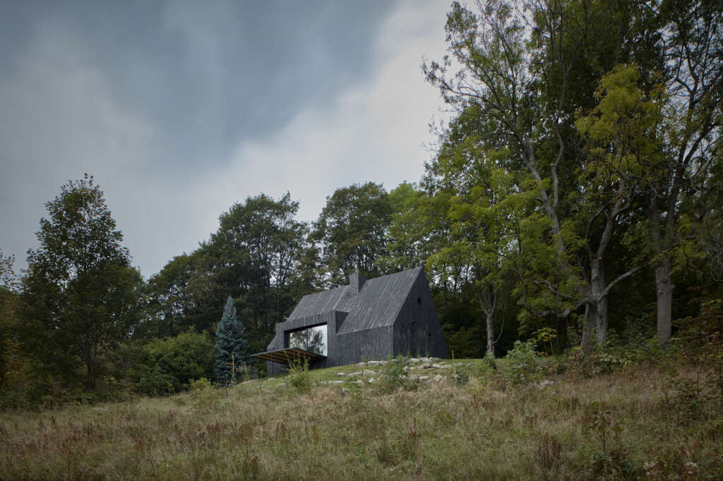 This charred wood cabin rises high in the Buková mountain
